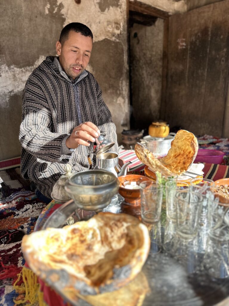 Man pours tea on high atlas food tour